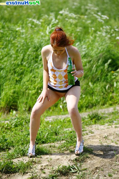 16P Drunk redhead teenie lifts up her skirt and tinkles outdoors