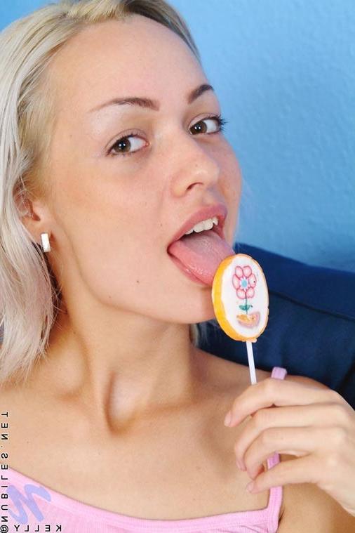13P Oh man look at how she sucks her lollipop i bet she is wishing it is a nice tast