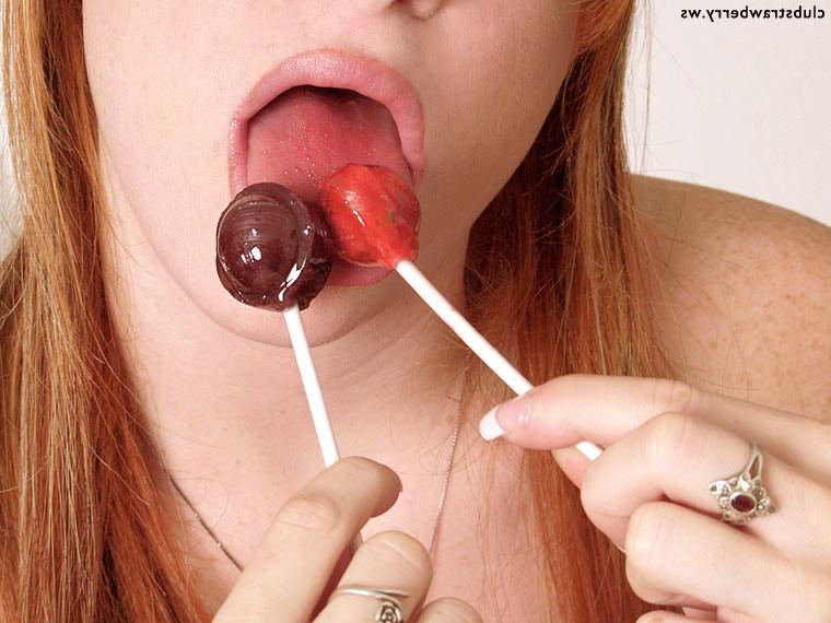 16P Lollipop sucking redhead spreads her pink pussy