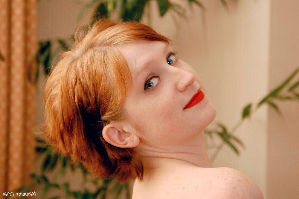 17P Redhead teen in stockings shows her tight little ass and pussy