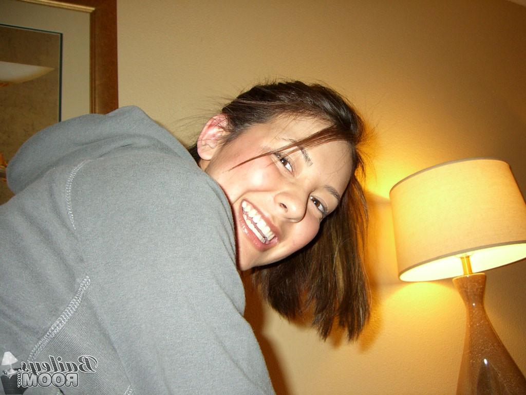 15P Busty teen cutie looks sexy in her torn pantyhose