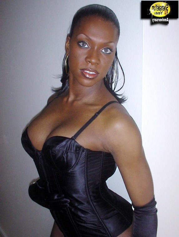 16P Really hot black shemale in black lingerie showing her dick