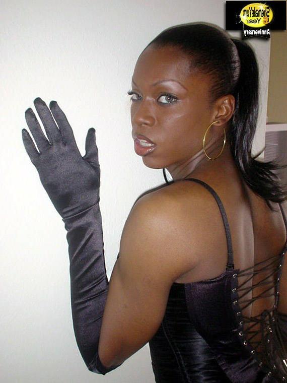 16P Really hot black shemale in black lingerie showing her dick