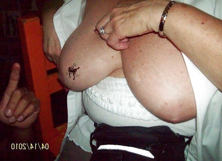 7P Drunk granny gets a tattoo on her tit