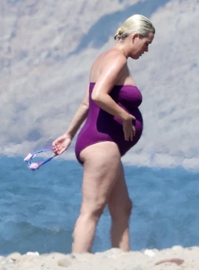 19P Katy Perry pregnant in a purple swimsuit