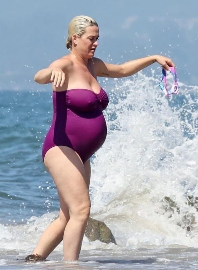 19P Katy Perry pregnant in a purple swimsuit