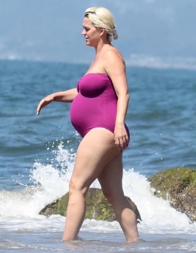19P Katy Perry pregnant in a purple swimsuit