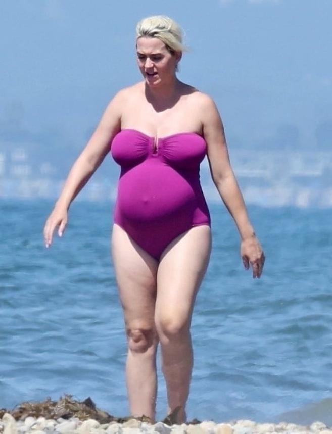 19P Katy Perry pregnant in a purple swimsuit