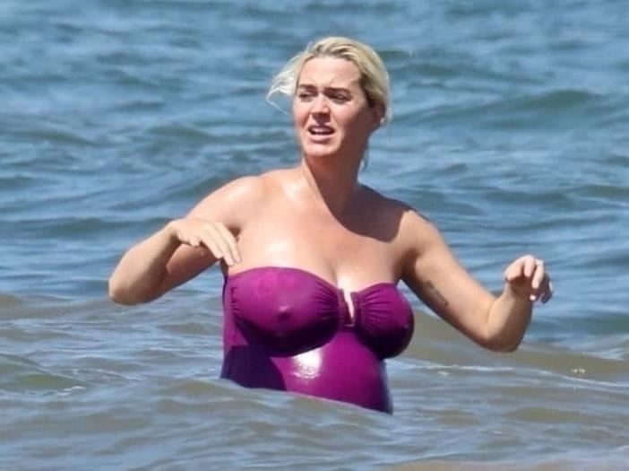 19P Katy Perry pregnant in a purple swimsuit