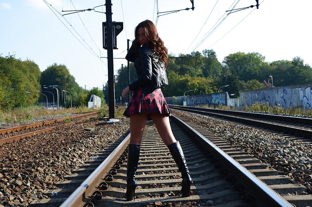 4P Young teen slut on the railway... in high heels boots