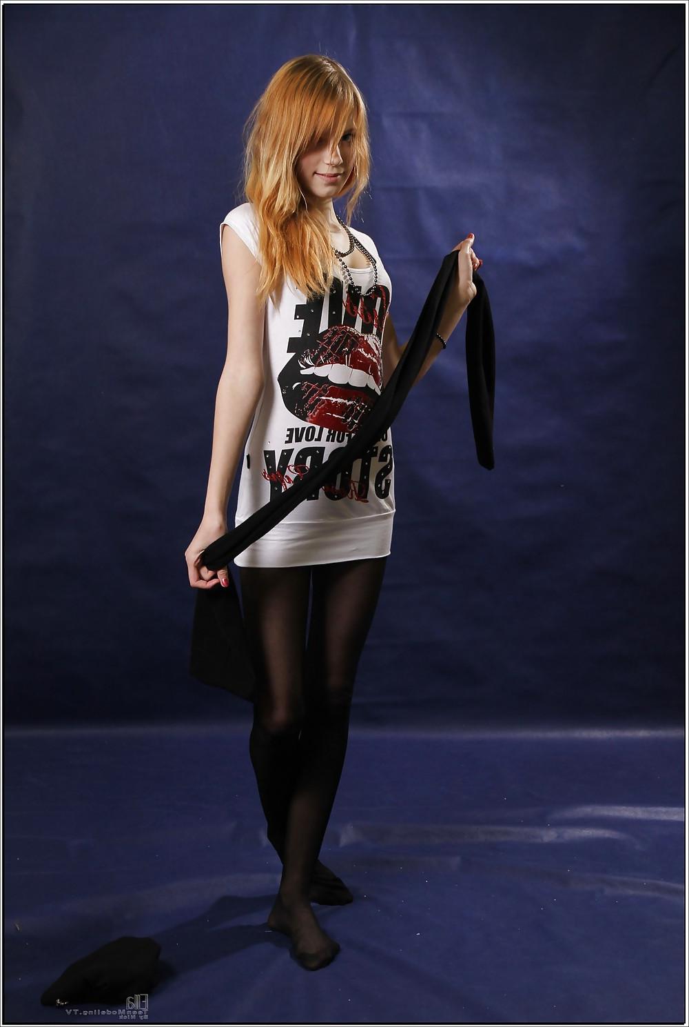17P Lovely teen in black pantyhose