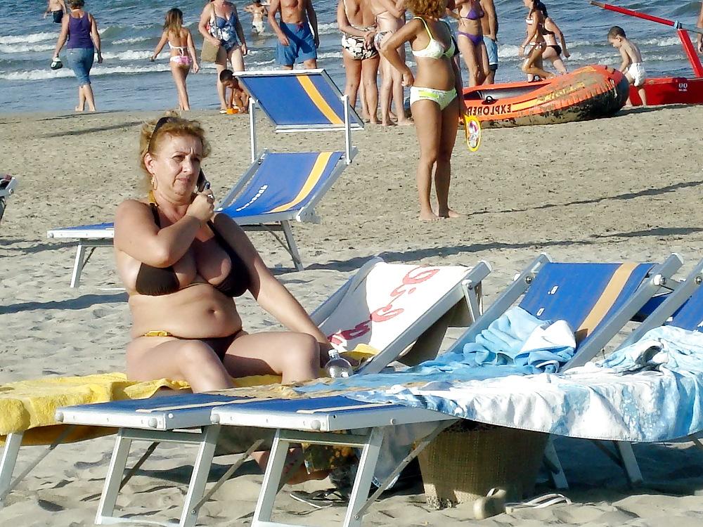 25P Busty granny on the beach! Mixed!