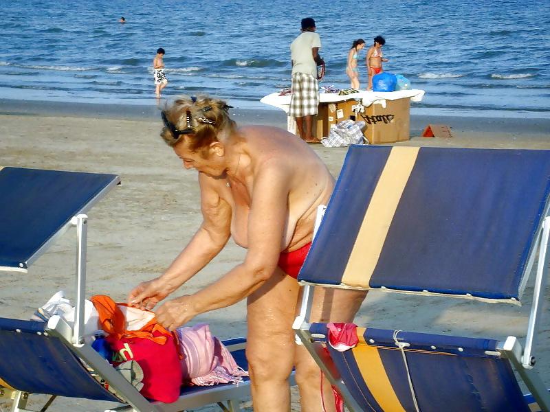 25P Busty granny on the beach! Mixed!