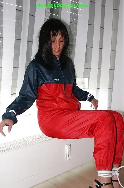 23P Girls in shiny nylon panats and tracksuits