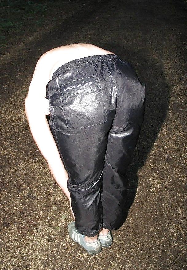 23P Girls in shiny nylon panats and tracksuits