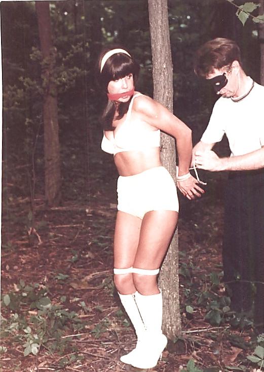 24P Retro bondage-stripped in the forest.