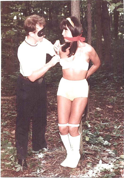 24P Retro bondage-stripped in the forest.