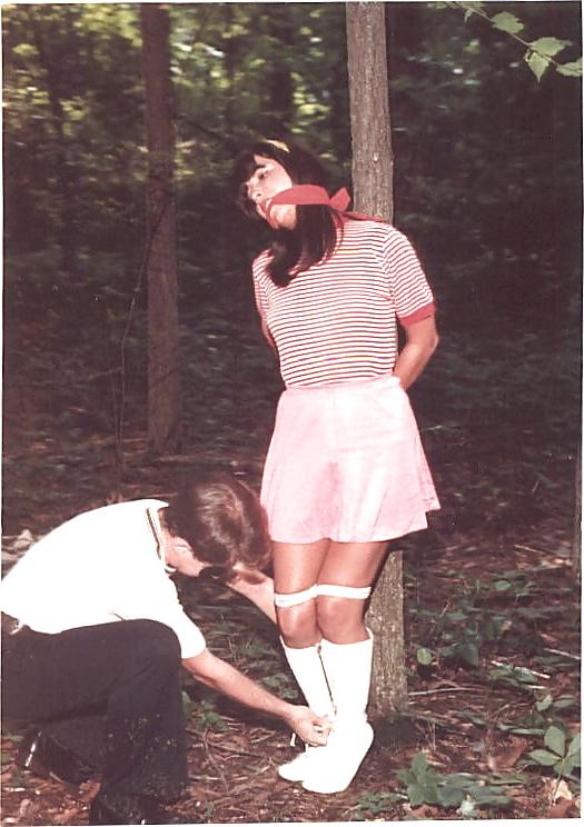 24P Retro bondage-stripped in the forest.