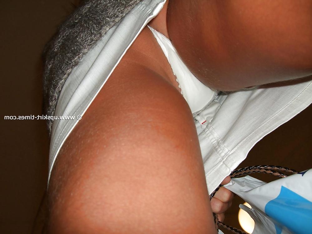 13P Slim tanned girl in a short white skirt