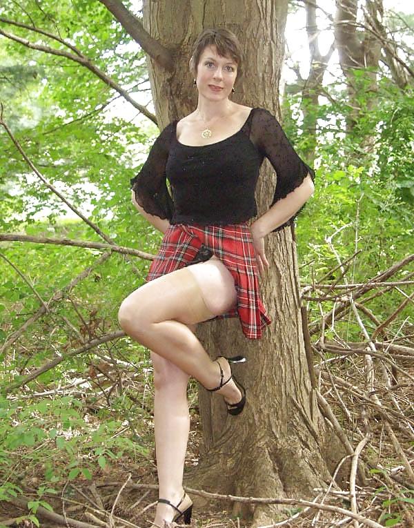 8P The lovely Miss Jones wears tartan skirt.