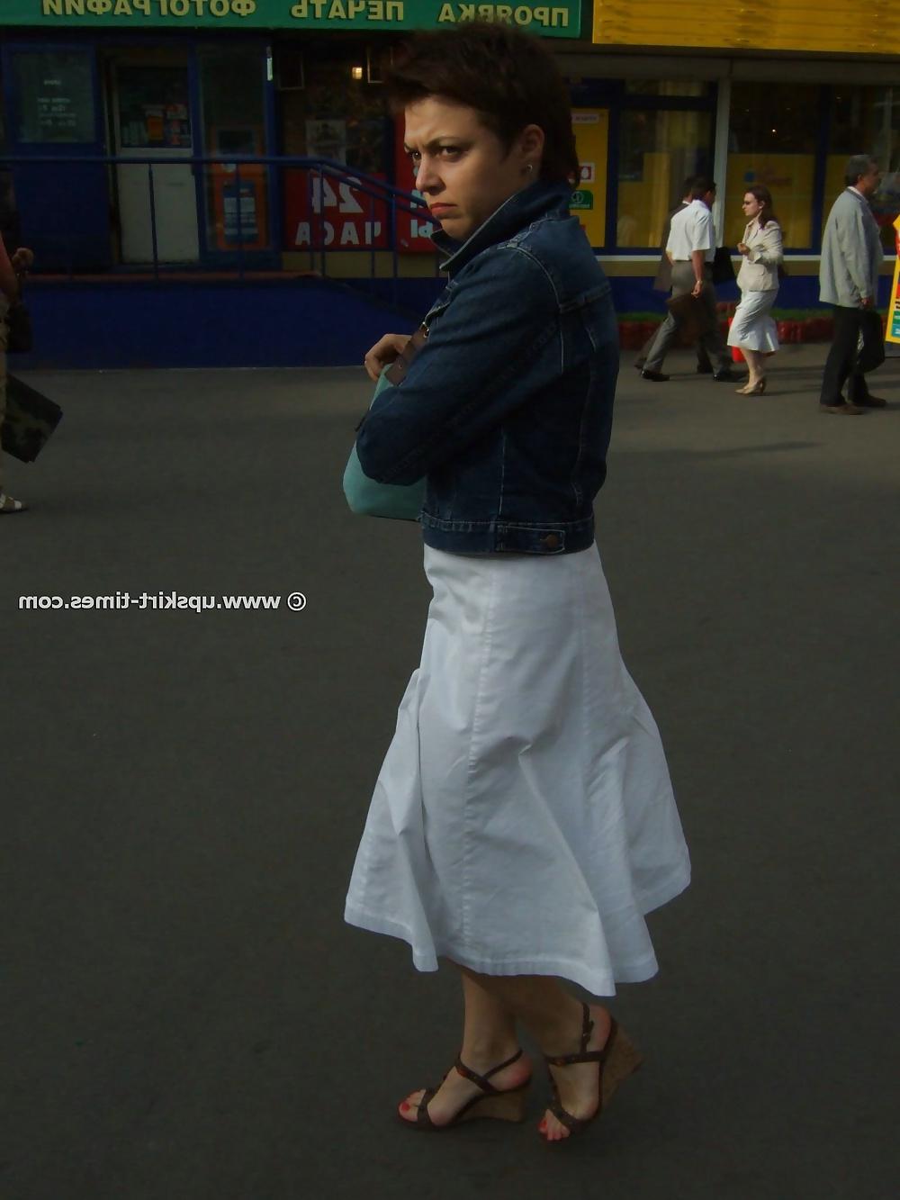 11P Brunette in a long white skirt
