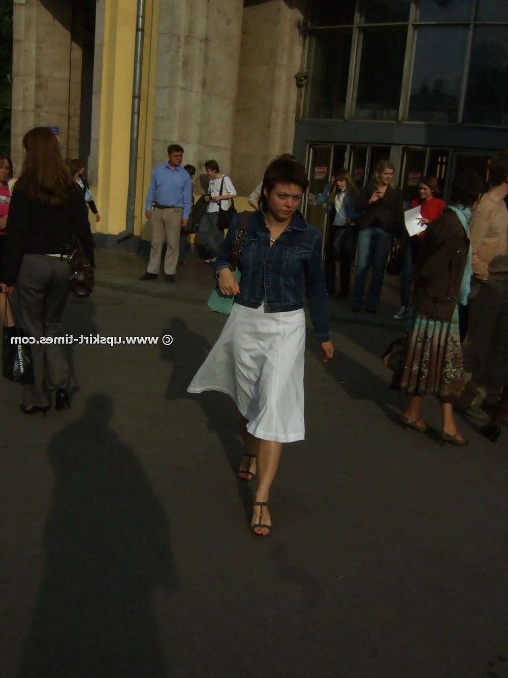 11P Brunette in a long white skirt