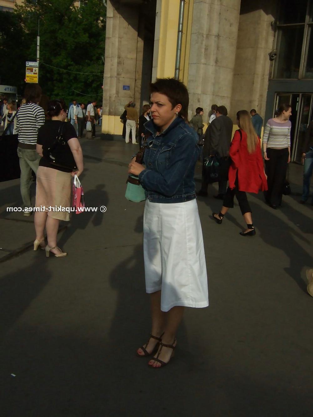 11P Brunette in a long white skirt
