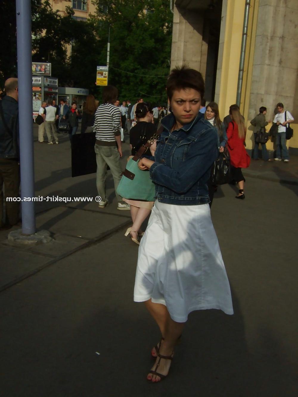 11P Brunette in a long white skirt