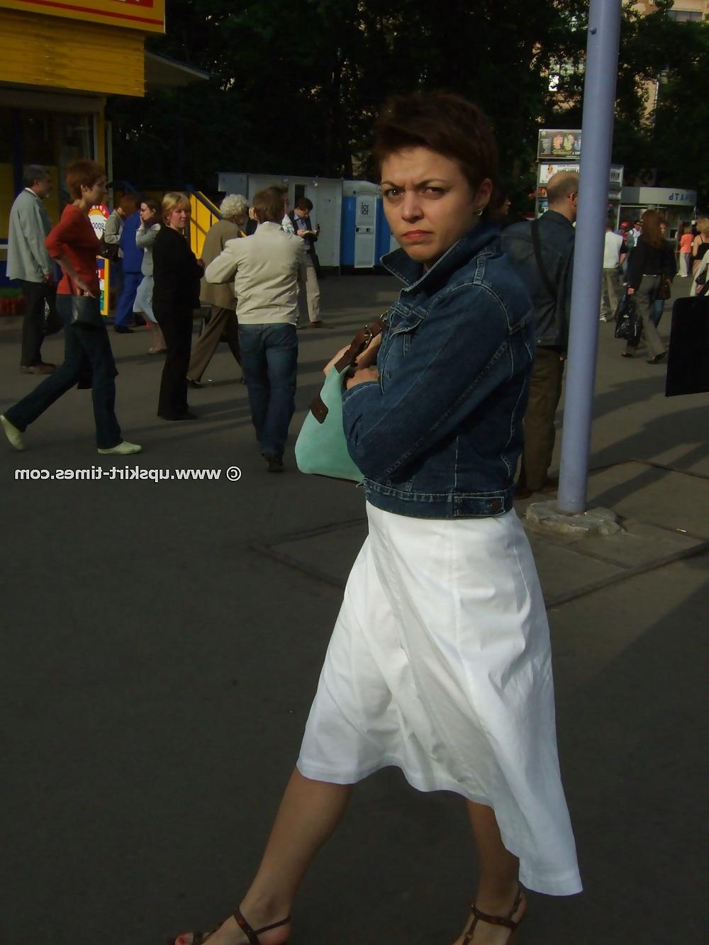 11P Brunette in a long white skirt
