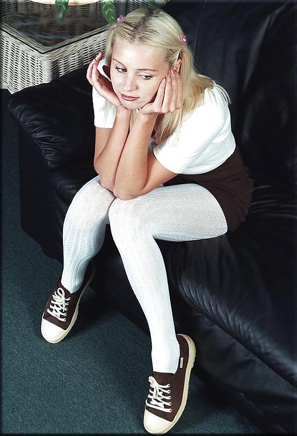 5P Cute blonde on a leather couch