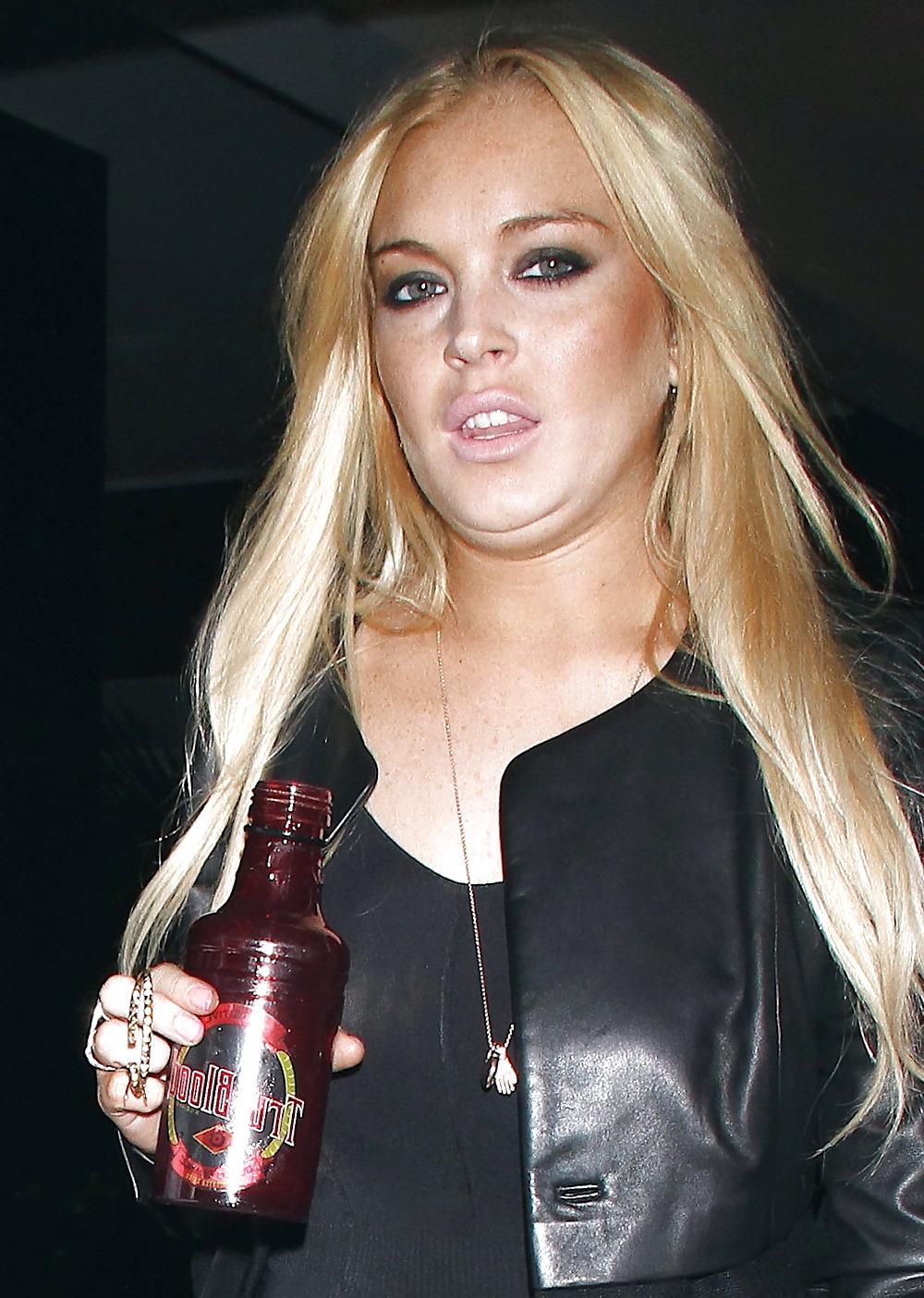 15P Lindsay Lohan leaves her hollywood home in a sexy mini-skirt