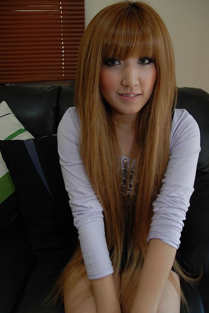 16P Seductive asian baby doll Hikari Asakawa undressing on the bed