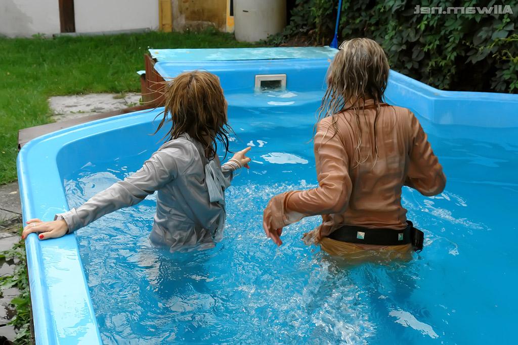 16P Tatiana Milovani has some fully clothed fun with her friend in the pool