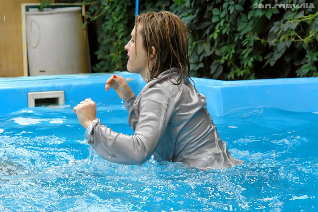 16P Tatiana Milovani has some fully clothed fun with her friend in the pool