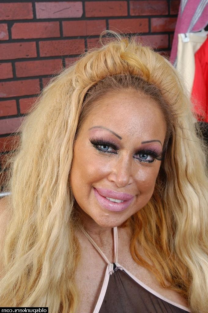 16P Buxom granny Pamela flaunting huge juggs while working out in weight room
