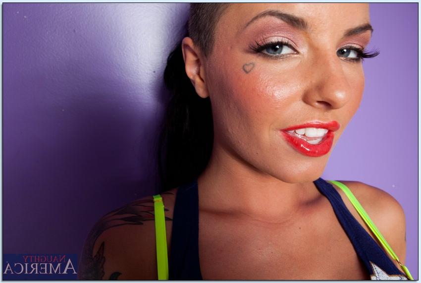 16P Busty tattooed teen babe Christy Mack stripping off her clothes