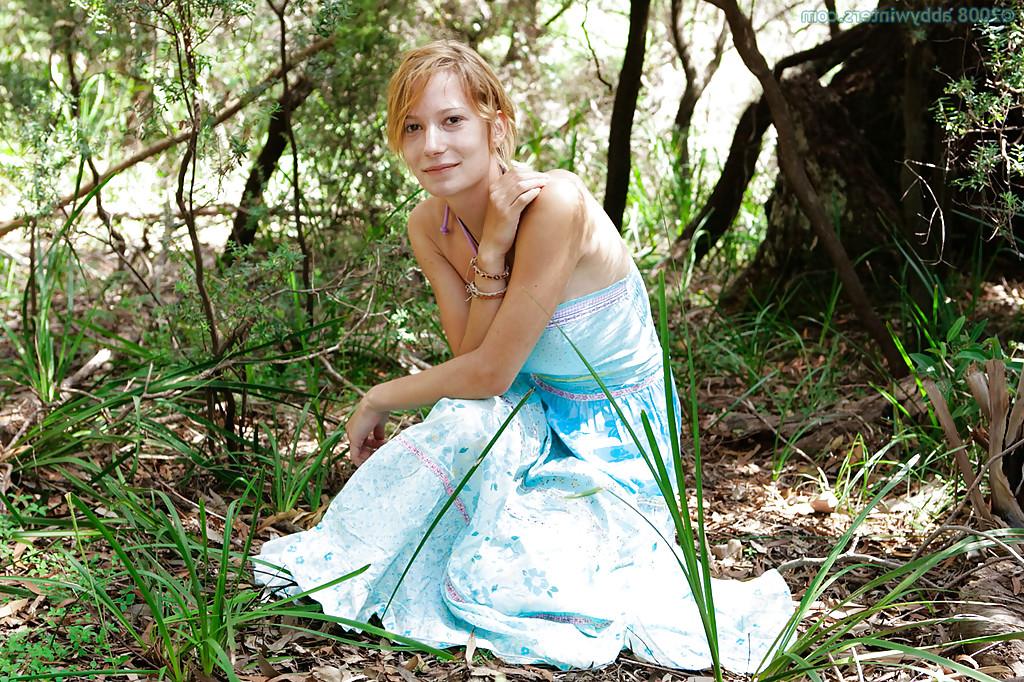 16P Redhead first timer Chanel flashes white panties from under skirt outdoors