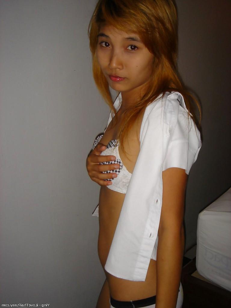14P Sweet asian babe lowering her panties and flashing her hairy cooter