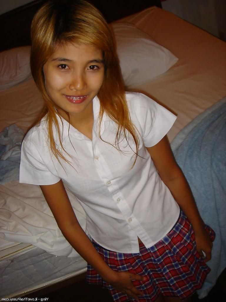 14P Sweet asian babe lowering her panties and flashing her hairy cooter