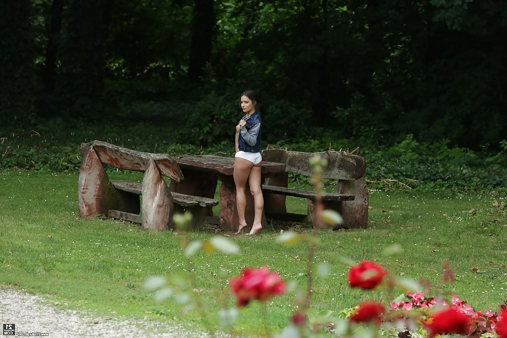 16P Sexy solo girl Anita Bellini showing off perky tits in white panties in woods