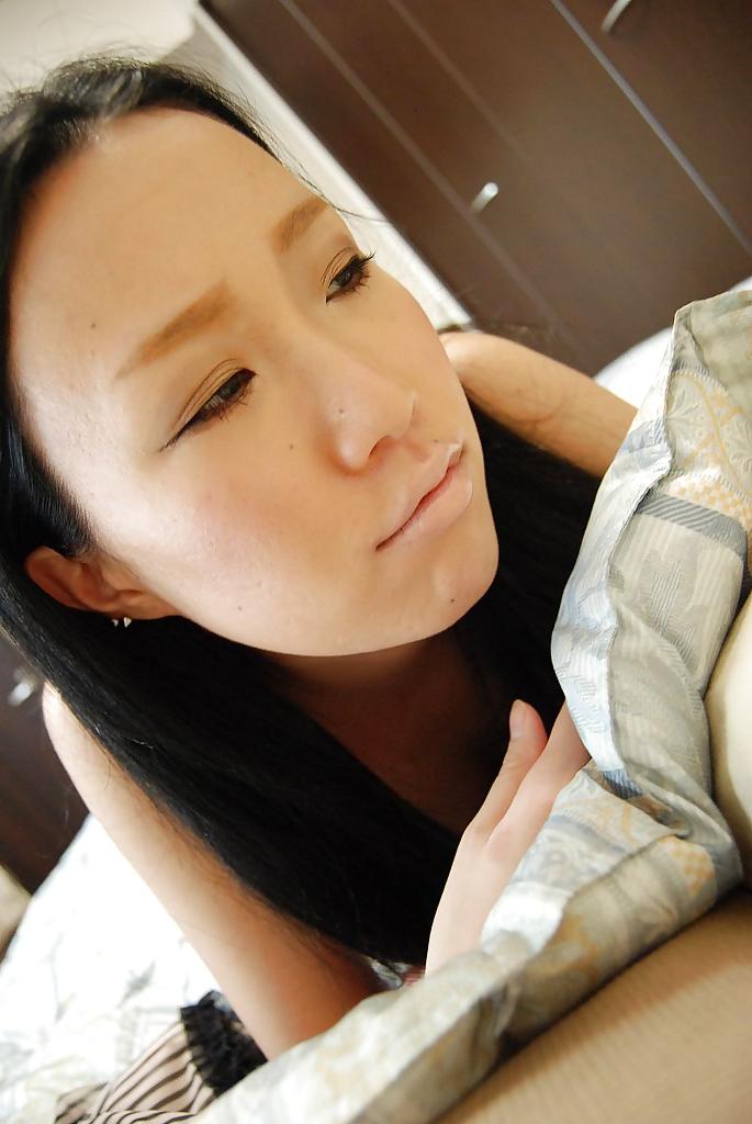 16P Undressing Asian babe with brunette hair Kanae Hiyama shows her ass