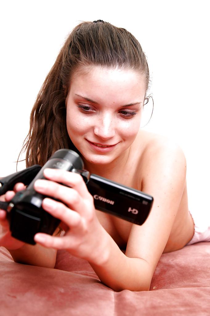 16P Foxy teen films herself stripping and masturbating her shaved slit