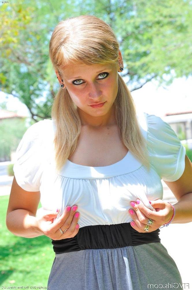15P Pictures of busty blonde teen Alice fucking herself with a cucumber outside