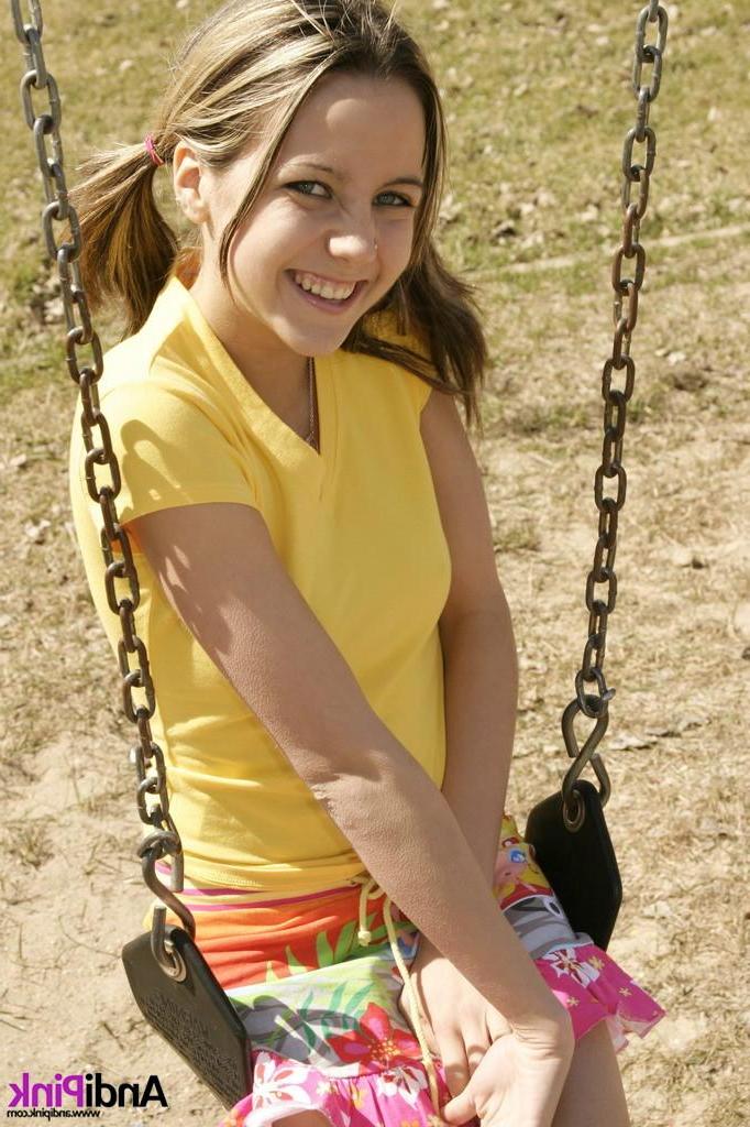 15P Andi Pink gets naked for you on a park swing