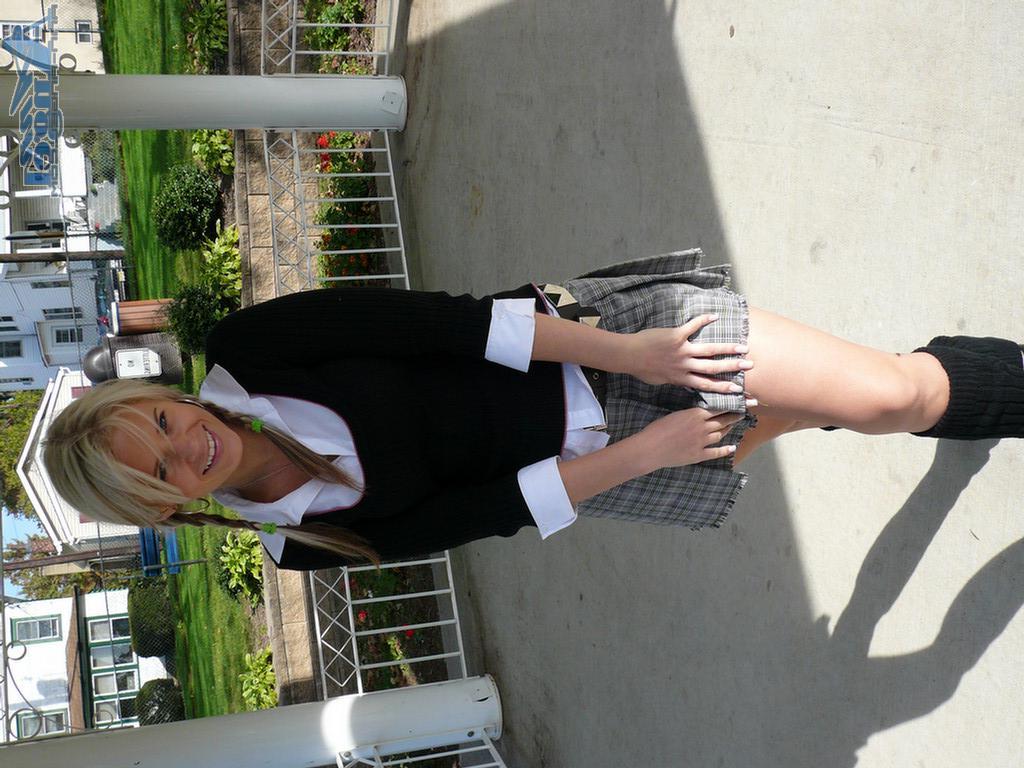 16P Ann Angel exposes her tits in a park