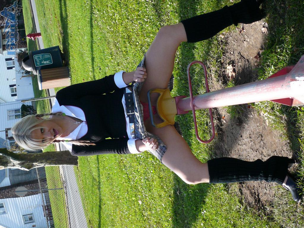 16P Ann Angel exposes her tits in a park