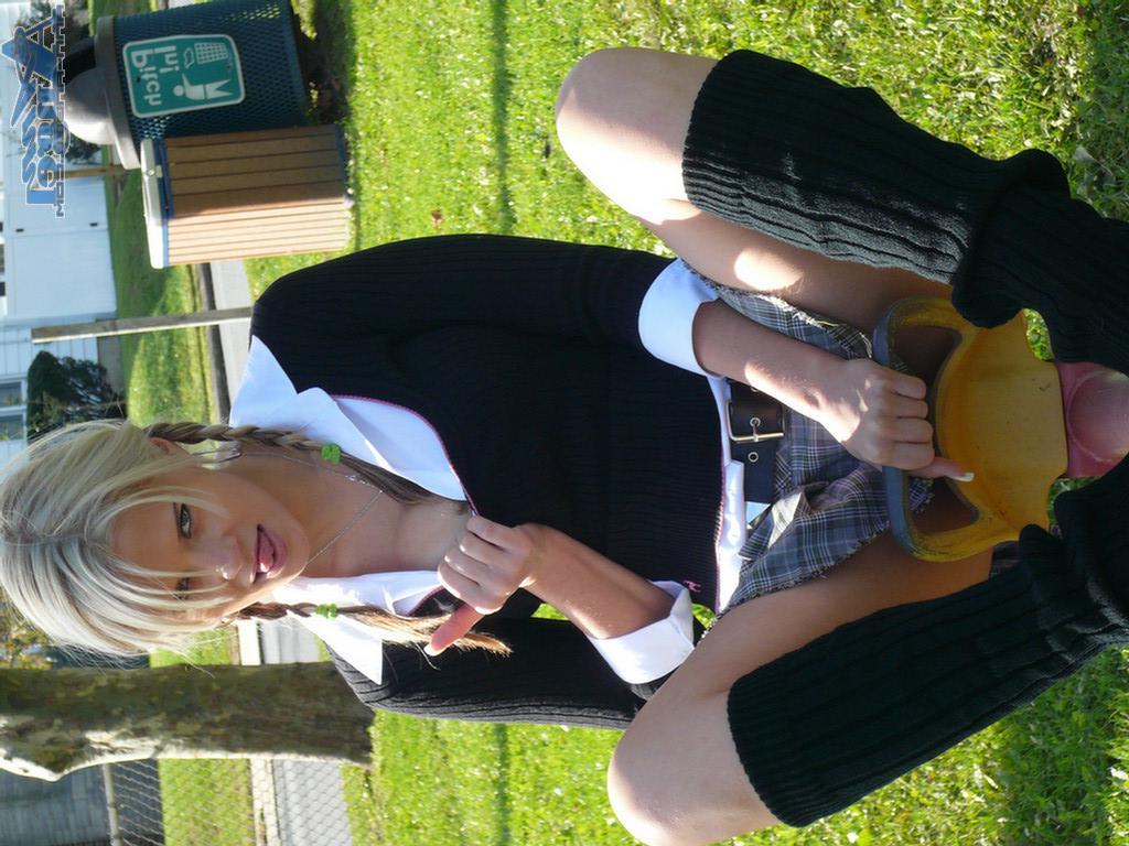 16P Ann Angel exposes her tits in a park