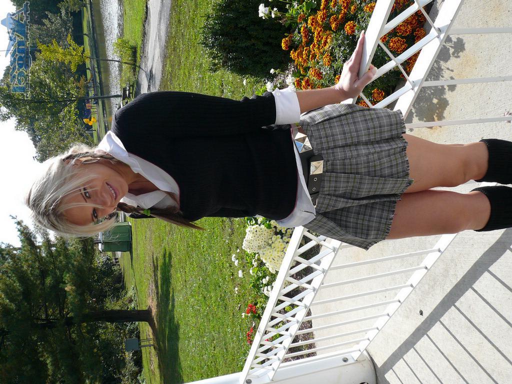 16P Ann Angel exposes her tits in a park