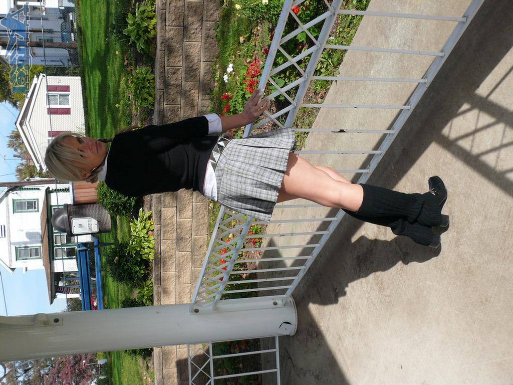 16P Ann Angel exposes her tits in a park
