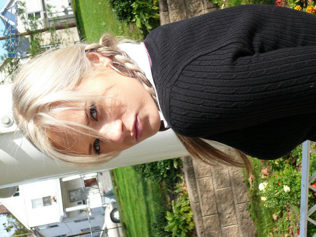 16P Ann Angel exposes her tits in a park